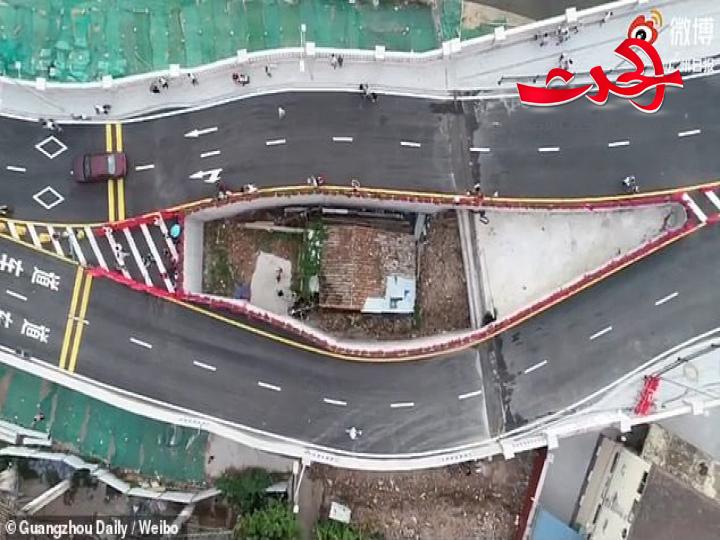 الصين تفتتح جسرا حول منزل "سيدة عنيدة"