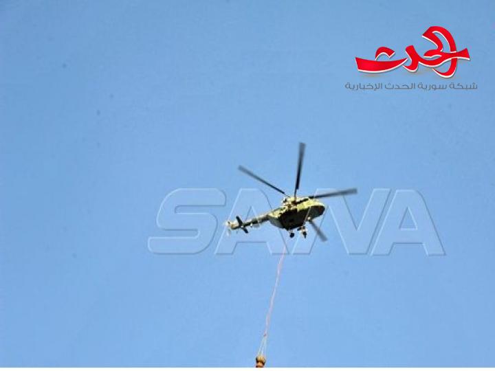 فرق الإطفاء بمشاركة مروحيات الجيش تواصل عمليات إخماد حريق بأعالي أحراج جبل الشعرة بريف اللاذقية