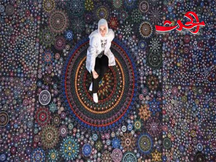 فتاة سورية تدخل موسوعة"غينيس" عن أكبر عرض ماندالا في العالم